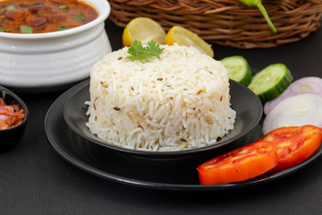 Rajma Chawal or Rajma Jeera Chawal (Rice) is a Traditional North Indian Food, Consisting of Cooked Red Kidney Beans in a Thick Gravy with Spices. Served with Jeera Rice