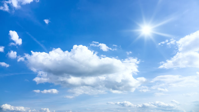 typical beautiful blue sky sun clouds background