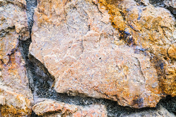 Old medieval rock wall background and texture, close-up.