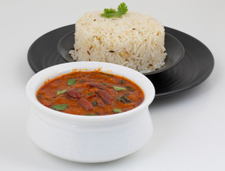 Rajma Chawal or Rajma Jeera Chawal (Rice) is a Traditional North Indian Food, Consisting of Cooked Red Kidney Beans in a Thick Gravy with Spices. Served with Jeera Rice