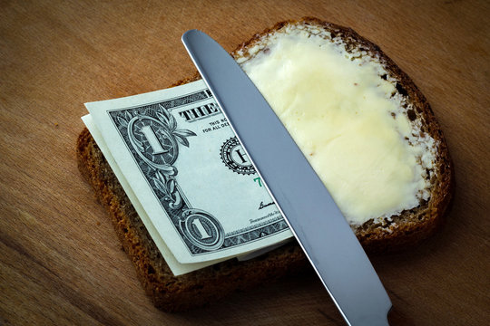 Butter and money on bread