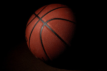 Basketball ball isolated on black background.