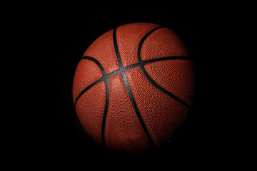 Basketball ball isolated on black background.