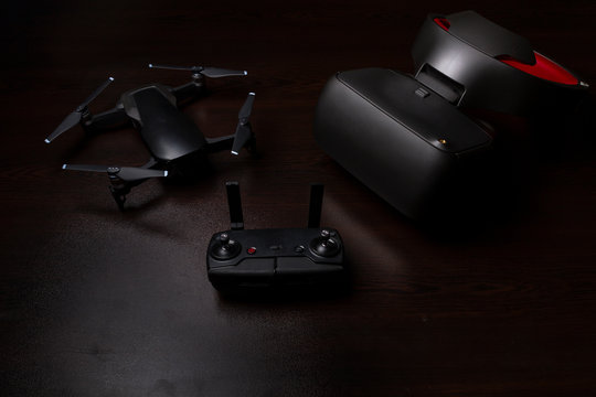 Drone quadcopter with a flight remote controller and vr goggles.
