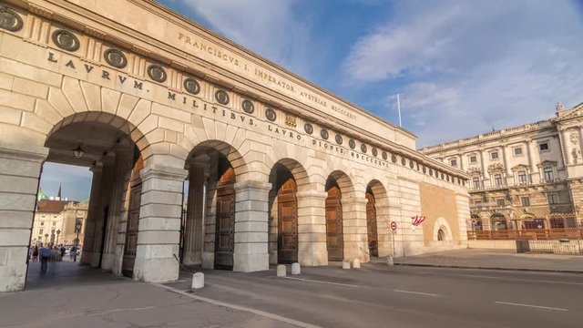 Exterior of outer castle gate (Burgtor) from Ringstrasse timelapse hyperlapse in Vienna city in sunny day. Blue cloudy sky. The gate of Hofburg area was erected in 1818