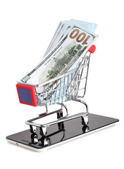 Supermarket trolley and dollars whit smartphone on white background