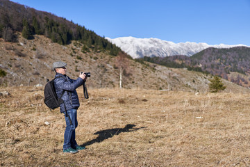 Fototapeta premium Man with backpack in the countryside