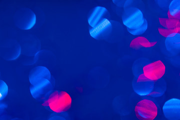 Dark blue background with light effects and white and pink lens flares