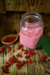 Cocktail or milk drink yogurt from red currant is poured into a glass bowl