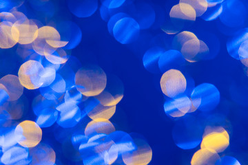 Dark blue background with light effects and white and yellow lens flares