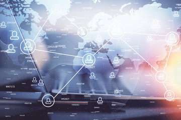 Computer on desktop with social network theme icon. Multi exposure. Concept of international connections.