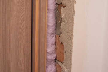 Installation of doors using polyurethane foam mounting