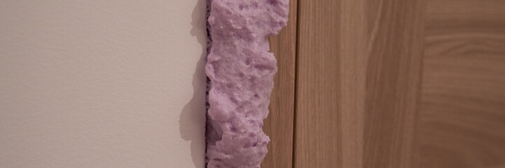 Installation of doors using polyurethane foam mounting - obrazy, fototapety, plakaty