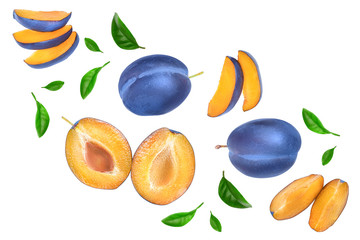fresh blue plum and half with leaves isolated on white background. Top view. Flat lay