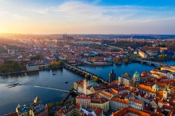 Aluminium Prints Prague Aerial Prague panoramic drone view of the city of Prague at the Old Town Square, Czechia. Prague Old Town pier architecture and Charles Bridge over Vltava river in Prague at sunset, Czech Republic.