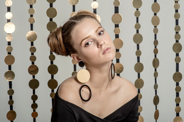 girl with fashion makeup posing in the Studio on a white background with garlands