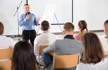 Male teacher lecturing to students