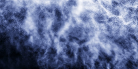 A stream of water and a cloud of drops