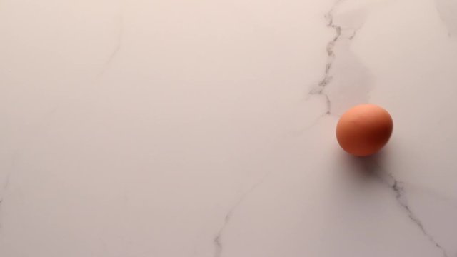 Egg on marble table as minimalistic food flat lay, top view food brand videography flatlay and recipe for cooking vlog, menu or diet plan ad