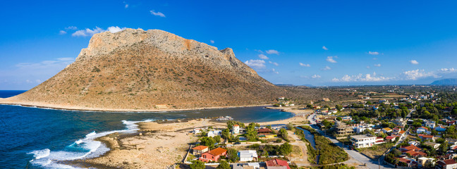 Aerial drone top view of turquoise organised beach forming a small heart shaped lagoon and...