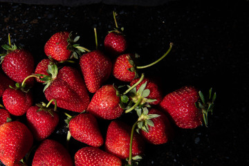 fresh strawberries on black background