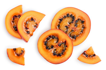 Fresh tamarillo fruit slices with leaves isolated on white background. Top view. Flat lay. Set or collection