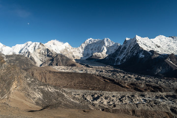 Obraz premium View of the Chukung valley with the island peak, Makalu from the top of Chukung Ri viewpoint in the Himalayas in Nepal