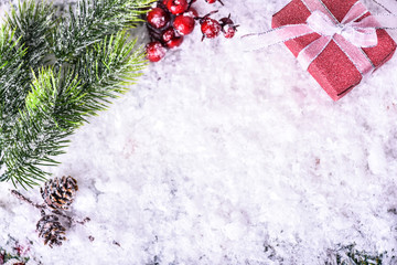 Fototapeta na wymiar Christmas Gift Box with white Ribbon in snow.