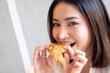 hungry woman looking, eating fried chicken, concept of delicious food, health care, eating habit, yummy fried chicken