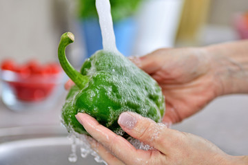 Washing vegetables.