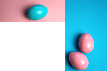 Creative minimalist layout made of eggs and color block background. Flat lay. Easter concept frameing
