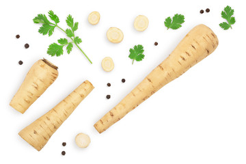 Parsnip root and slices with parsley peppercorns isolated on white background with copy space for your text. Top view. Flat lay,