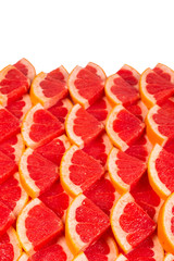 Grapefruit red juicy slices background. top view.