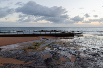 Rock formation and pool at Newport Beach coastline. Sydney, Australia.