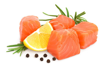 raw salmon piece cube with rosemary, lemon and peppercorn isolated on white background close up