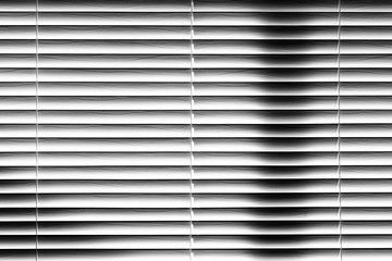 Abstract Venetian Blinds Background, light and shadows on white wooden slats, window covering.
