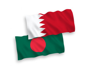 Obraz premium National vector fabric wave flags of Bangladesh and Bahrain isolated on white background. 1 to 2 proportion.