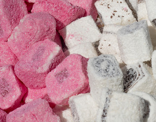 Lokum the “Turkish Delight”, famous Istanbul sweet dessert, confectionery shop. Pink and white...