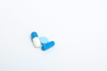 Macro view of capsule pill and tablet isolated over white background