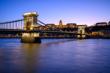 Fototapeta na wymiar Budapest iconic Chain Bridge by night over the Danube River with the Royal Palace and the President's Palace