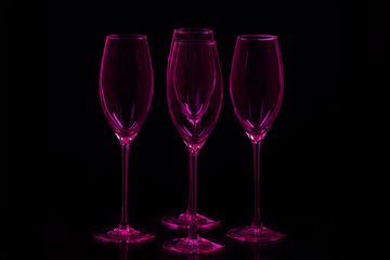 empty purple wine glasses on black  background