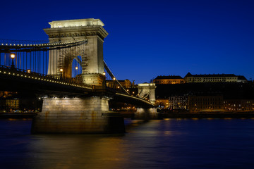 Obraz premium Budapest iconic Chain Bridge by night over the Danube River with the Royal Palace and the President's Palace