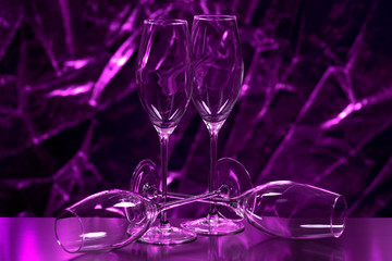 empty wine glasses on purple  background