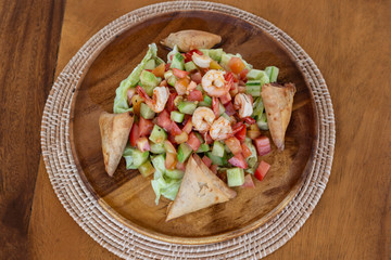 Plate with mixed shrimps salat.
