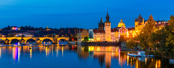 Charles Bridge in Prague in Czechia. Prague, Czech Republic. Charles Bridge (Karluv Most) and Old Town Tower. Vltava River and Charles Bridge. Concept of world travel, sightseeing and tourism.