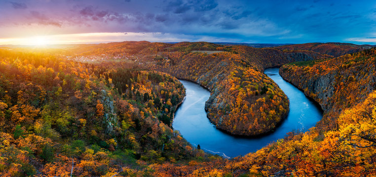 Beautiful Vyhlidka Maj, Lookout Maj, near Teletin, Czech Republic. Meander of the river Vltava surrounded by colorful autumn forest viewed from above. Tourist attraction in Czech landscape. Czechia.
