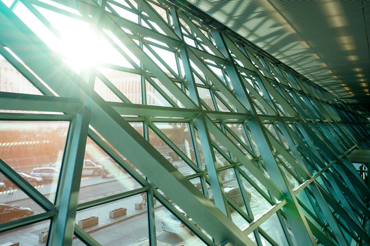 sloping metal structure of the public building facade from the inside, modern architecture, the facade of the building is made of metal and glass. huge welded metal structures