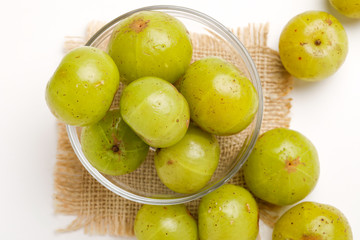 Fresh Indian gooseberry in glass bowl 
