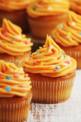 Cupcakes with orange icing on top