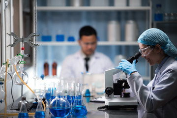 Health care researchers working in life science laboratory
